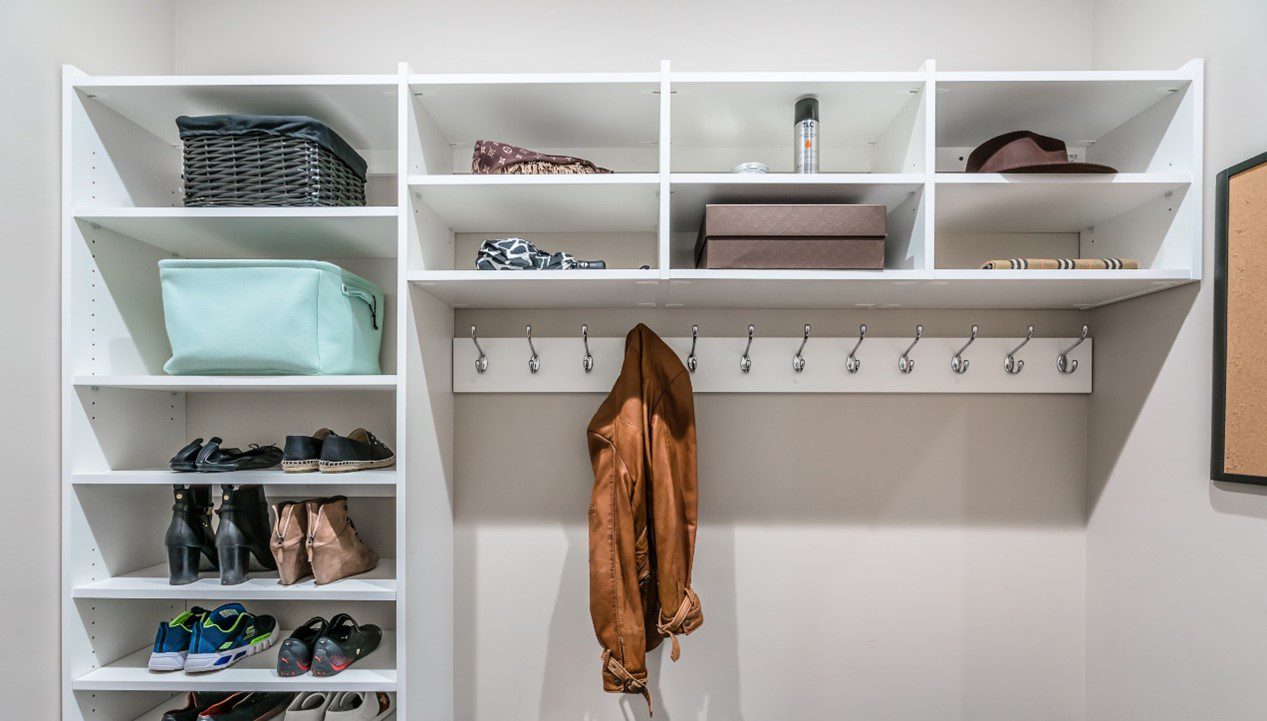 Mudroom custom closet with bench and coat hooks