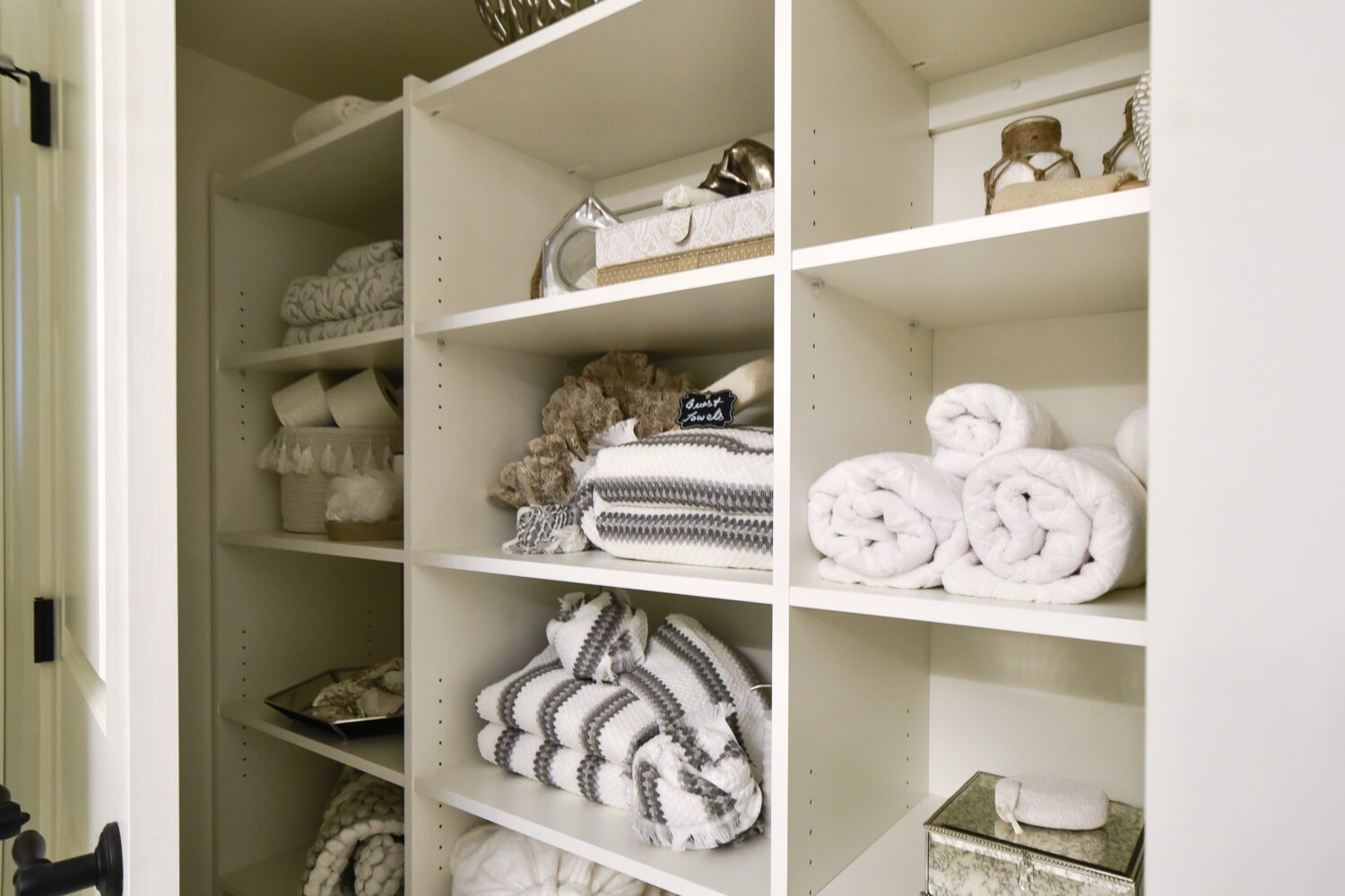 Laundry room custom closet to store towels and toilet paper